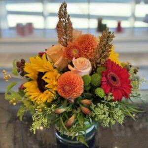 Yellow. orang and red color Thanksgiving flower arrangement