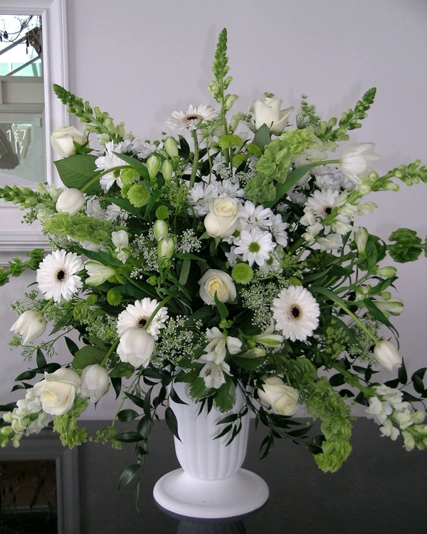White roses and gerberas sympathy arrangement